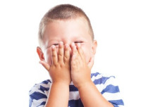 a embarrassed kid on a white background