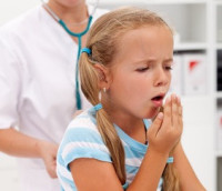 Coughing little girl on health checkup