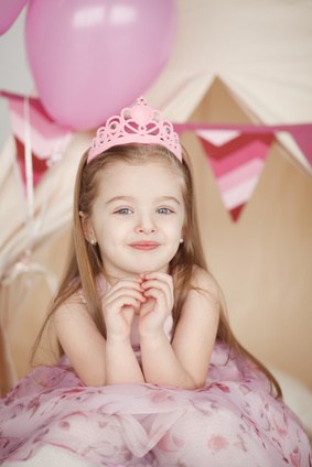 cute smiling little girl in pink princess