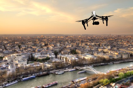 Drone flying above Paris city panorama