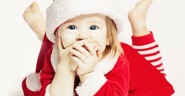 Happy Baby in Santa Hat. Infant Child Laughing