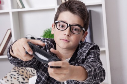 child at home playing with the video games or game console