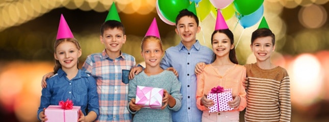 happy children with gifts at birthday party